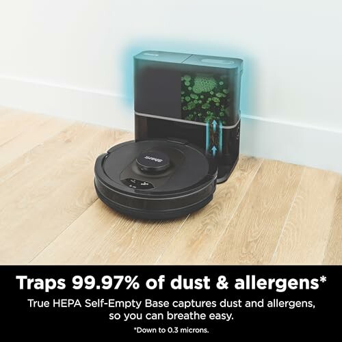 Robot vacuum with HEPA self-empty base on hardwood floor.